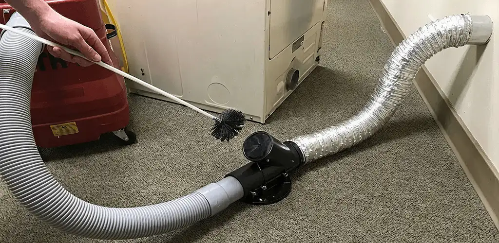 Dryer vent cleaning service removing lint from a dryer duct connection in Honolulu, HI
