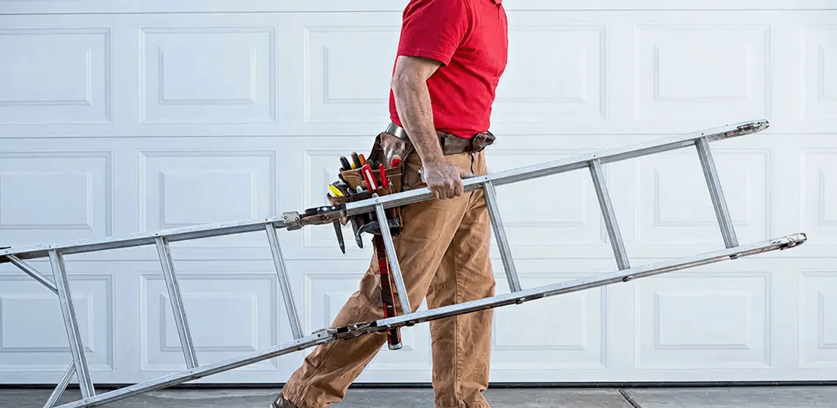Garage door repair technician arriving with tools and ladder in Honolulu, HI