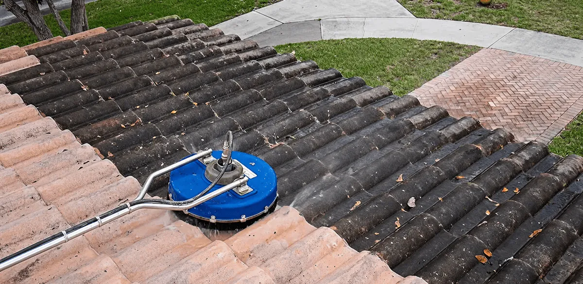Roof pressure cleaning removing debris and buildup from roof tiles in Honolulu, HI